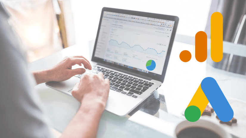 A digital marketer or business proposal working on a laptop with graphs and charts on the screen that mimics the Google Ads and Google Analytics platform  representing integration and setup for digital marketing success.