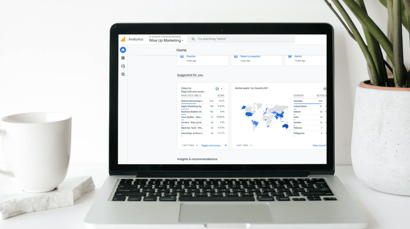 Laptop showing the insights portion of the google analytics platform where learnings such as conversions performance, traffic acquisition and landing page insights can be seen.
